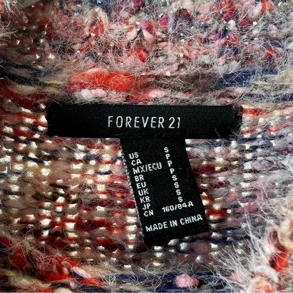 Multi-colored knitted sweater with mock neck and long sleeves - Picture 2 of 3